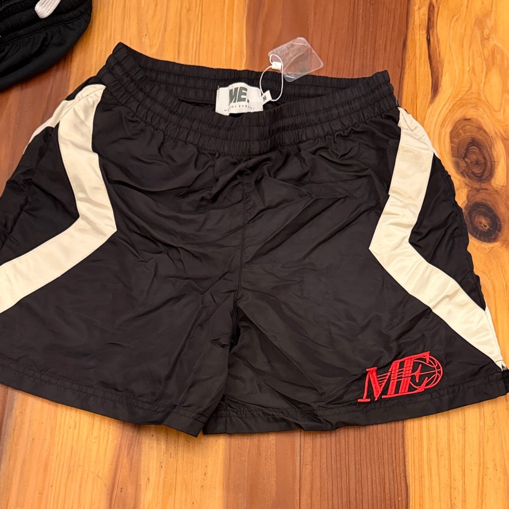 Melody Ehsani Black and Cream Athletic Shorts with Red basketball Logo